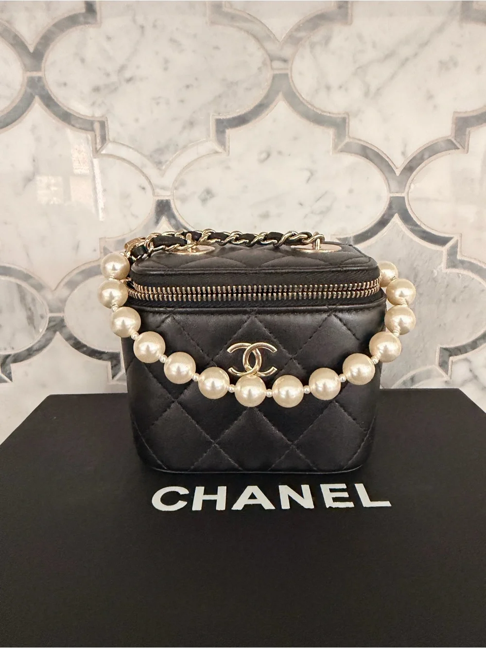 CHANEL Black Quilted Vanity Mini Bag with Pearl Strap